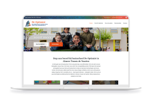 Laptop en telefoon met daarop de website van De Optimist