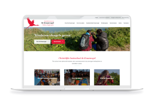 Laptop en telefoon met daarop de website van Christelijke basisschool de Kraanvogel